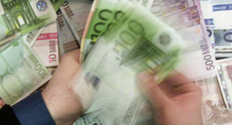 Комментарий: Еврозона продолжает тушить долговой пожар деньгами
