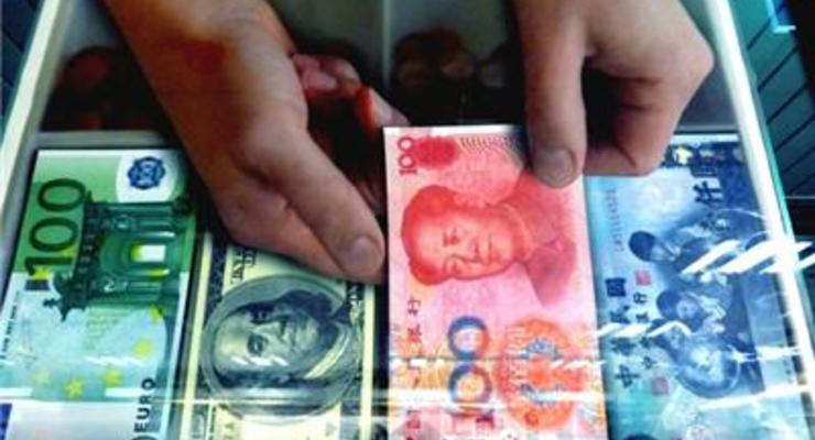 Народный банк Китая девальвировал юань до минимума 2011 года