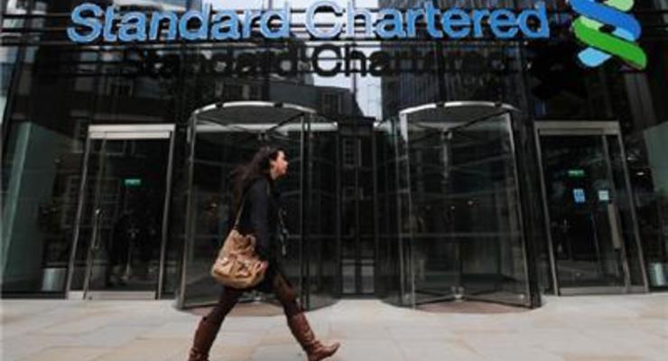 Standard Chartered сократил прибыль втрое